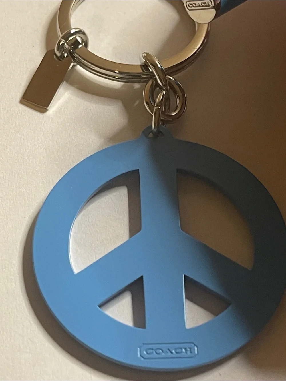 Coach Light Blue Crystal Peace Sign Keyring and Coach Pen